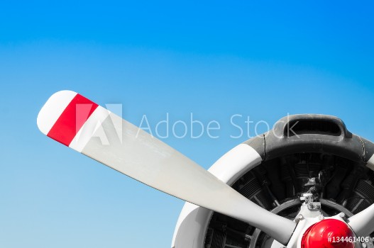 Picture of Vintage airplane propeller with radial engine on blue sky